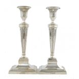 A PAIR OF VICTORIAN SILVER CANDLESTICKS with nozzles, 27cm h, by Thomas Bradbury & Sons, London