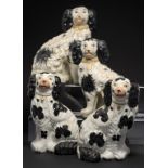 TWO PAIRS OF STAFFORDSHIRE EARTHENWARE MODELS OF SPANIELS, C1900 25 and 26cm h ++Undamaged, no