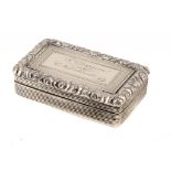 A VICTORIAN SILVER SNUFF BOX with foliate chased border and engraved T Chapman from C M Caldecott