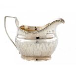 A GEORGE III SILVER OVAL CREAM JUG 9cm h, by Samuel and Edward Davenport, London 1808, 4ozs ++An