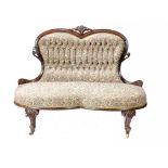A VICTORIAN CARVED WALNUT SETTEE OF UNUSUALLY SMALL SIZE, C1870 on pottery castors, 89cm h, 120cm