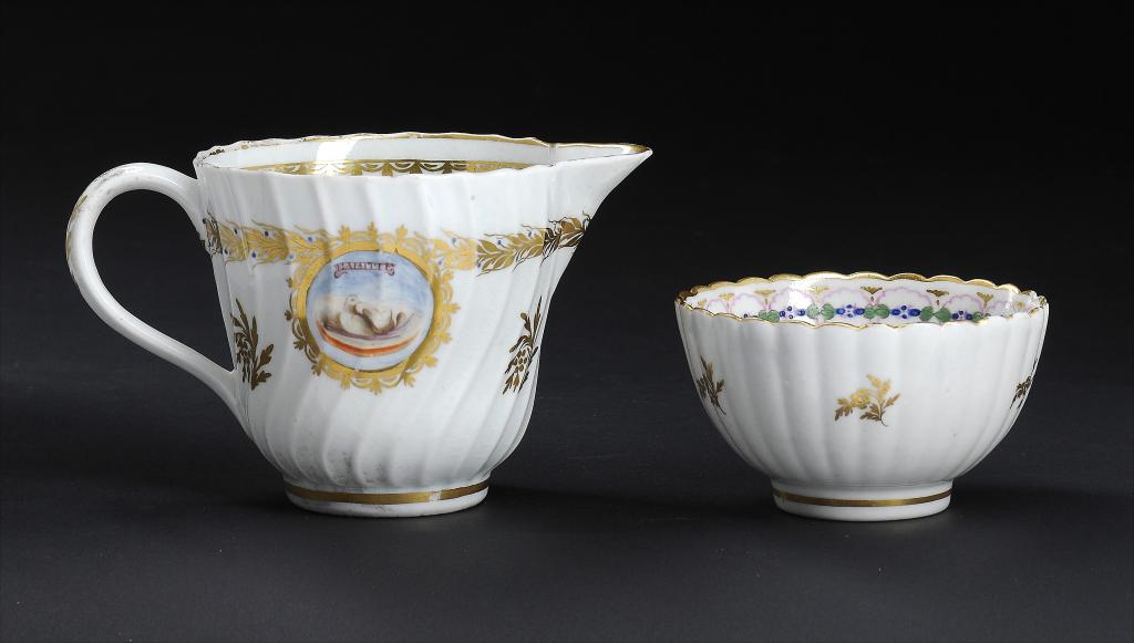 A CAUGHLEY POLYCHROME SHANKED CREAM JUG AND MATCHING TEA BOWL, C1788-93 enamelled with the L'