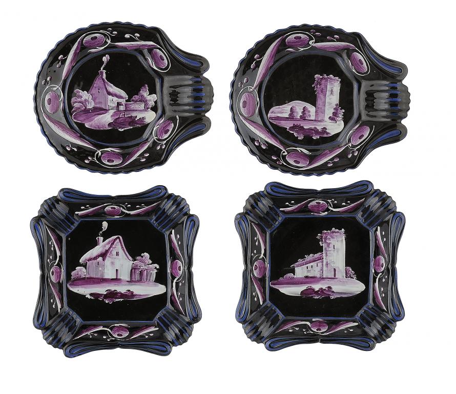 TWO PAIRS OF STAFFORDSHIRE WHITE AND PURPLE ENAMEL PAINTED BLACK GROUND EARTHENWARE DESSERT