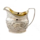 A GEORGE III SILVER OVAL CREAM JUG later chased, 8cm h, by Thomas Wallis, London 1806, 3ozs ++In