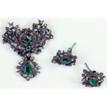 AN ANTIQUE EMERALD AND DIAMOND BROOCH - PENDANT AND PAIR OF EARRINGS, PROBABLY EASTERN EUROPEAN, MID