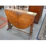 A VICTORIAN WALNUT SUTHERLAND TABLE WITH OVAL TOP