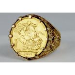 GOLD COIN.  SOVEREIGN 1911, SET IN A 9CT GOLD RING, 16.5G