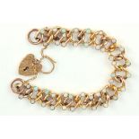 A GOLD CURB BRACELET SET WITH OPALS, WITH 9CT GOLD PADLOCK, CIRCA 1910, 13.2G