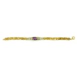 AN AMETHYST BRACELET, INCORPORATING TWO LENGTHS OF GOLD FENCE SECTION