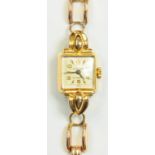 A SWISS 18CT GOLD LADY'S WRISTWATCH, THE GOLD BRACELET MARKED 14K, 23 G GROSS