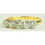 A DIAMOND FIVE STONE RING WITH ROUND BRILLIANT CUT DIAMOND in gold, size Q