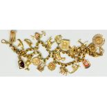 A GOLD CHARM BRACELET, 44G