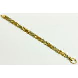 A 9CT TWO COLOUR GOLD FLAT CURB BRACELET, 24.3G