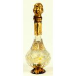 A CONTINENTAL GOLD MOUNTED CUT GLASS SCENT BOTTLE, MID 19TH CENTURY, FAULTS