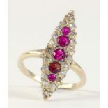 A RUBY AND ROSE DIAMOND NAVETTE CLUSTER RING IN GOLD, MARKED 18CT, 2.9G