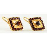 A PAIR OF GARNET SET DIAMOND SHAPED CLUSTER EARRINGS IN GOLD, MARKED 18K, 7.4G GROSS