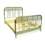 A FRENCH PLATED BRASS BED, WITH LEAF CLAD AND REEDED HEAD AND FOOTBOARDS APPLIED WITH SWAGS, EARLY