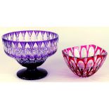 AN AMETHYST FLASHED AND CUT GLASS PEDESTAL BOWL AND A VAL ST LAMBERT RUBY FLASHED AND CUT GLASS