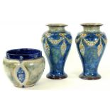 A PAIR OF DOULTON WARE VASES AND A DOULTON WARE JARDINIERE, BOTH CIRCA 1900