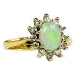 AN OPAL AND DIAMOND CLUSTER RING IN 18CT GOLD, 4G