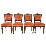 A SET OF FOUR VICTORIAN CARVED OAK DINING CHAIRS, WITH PADDED BACK