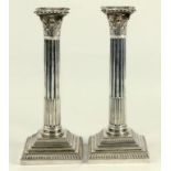 A PAIR OF EDWARD VII SILVER CORINTHIAN COLUMN CANDLESTICKS, LONDON 1904, LOADED