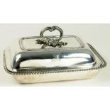 A GEORGE IV SILVER GADROONED OBLONG ENTREE DISH AND COVER, CRESTED, LONDON 1821, 53OZS