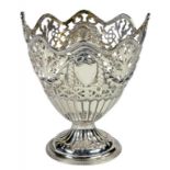 A GEORGE III PIERCED SILVER SUGAR BASKET EMBOSSED WITH SWAGS, LONDON 1776 (HANDLE DAMAGED), 4OZS