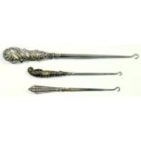 THREE SILVER HANDLED BUTTON HOOKS, VARIOUS MAKERS AND DATES, CIRCA 1900