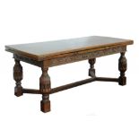 A CHARLES I STYLE OAK DRAW LEAF TABLE, THE BOARDED TOP WITH CLEATED ENDS