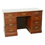 A VICTORIAN MAHOGANY KNEEHOLE DESK, TRADE LABEL OF JAMES SHOOLBRED & CO, REPOLISHED