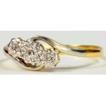 A DIAMOND THREE STONE CROSSOVER RING IN GOLD, MARKED 18CT PLAT, 2.8G