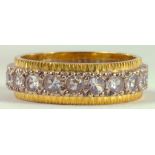 A DIAMOND ETERNITY RING IN TWO COLOUR GOLD, 4.4G
