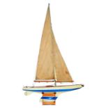 A GOOD QUALITY AND LARGE VANISHED WOOD POND YACHT, PAINTED CREAM, BLUE BENEATH THE WATERLINE WITH