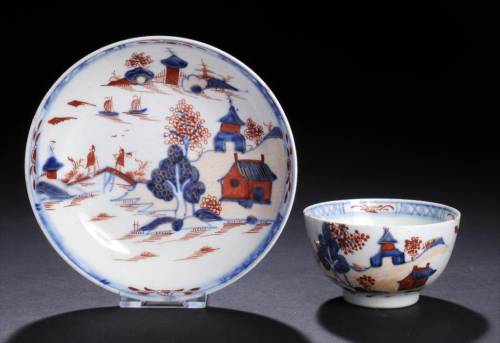 A LOWESTOFT TEA BOWL AND SAUCER, C1790  decorated in underglaze blue, iron red and gilt with a