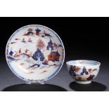 A LOWESTOFT TEA BOWL AND SAUCER, C1790  decorated in underglaze blue, iron red and gilt with a