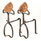 A PAIR OF ENGLISH ART NOUVEAU WROUGHT IRON AND EMBOSSED COPPER  ANDIRONS, C1905  38cm h ++In very