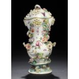 A DERBY WAISTED FRILL VASE AND A COVER, C1765  the vase painted with a bird on a branch and the