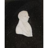 AN IVORY PORTRAIT RELIEF OF A MAN, EARLY 19TH C  7cm h, in contemporary rosewood frame ++In