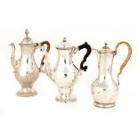 TWO OLD SHEFFIELD PLATE COFFEE POTS, C1765 AND AN UNUSUALLY EARLY HOT WATER JUG BY TUDOR & CO,