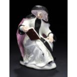 A BOW FIGURE OF AN ABBESS, C1758  seated reading the Absolution, 12.5cm h ++Lacks right foot and