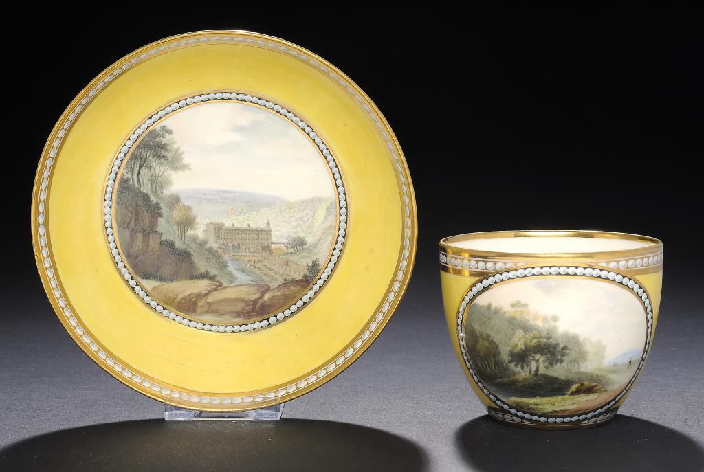 A FINE DERBY CANARY YELLOW GROUND TEACUP AND SAUCER, C1795 painted with a view of Sir Richard