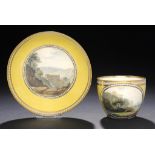 A FINE DERBY CANARY YELLOW GROUND TEACUP AND SAUCER, C1795 painted with a view of Sir Richard
