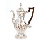 AN OLD SHEFFIELD PLATE BALUSTER COFFEE POT BY HOYLAND & CO, C1765  with repoussé flowers and