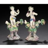 A PAIR OF BOW FIGURES OF CHILDREN, C1765  on pierced, marbled socles, 14cm h ++Some damage and one