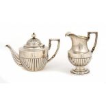 A FABERGÉ SILVER TEAPOT AND JUG  engraved with initials OL, ivory fittings, teapot 15.5cm h, maker's