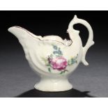 A DERBY POLYCHROME DOLPHIN EWER CREAMBOAT, C1770 enamelled with a rose spray to either side, 8.5cm h