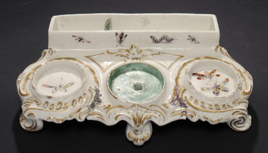 A RARE DERBY ROCOCO INKSTAND, C1765 enamelled with insects, 24.5cm w For the example in the Victoria