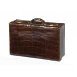 A CROCODILE HIDE SUITCASE, C1930  with gilt brass locks, 56cm w, locks engraved CROSS/EDINBURGH