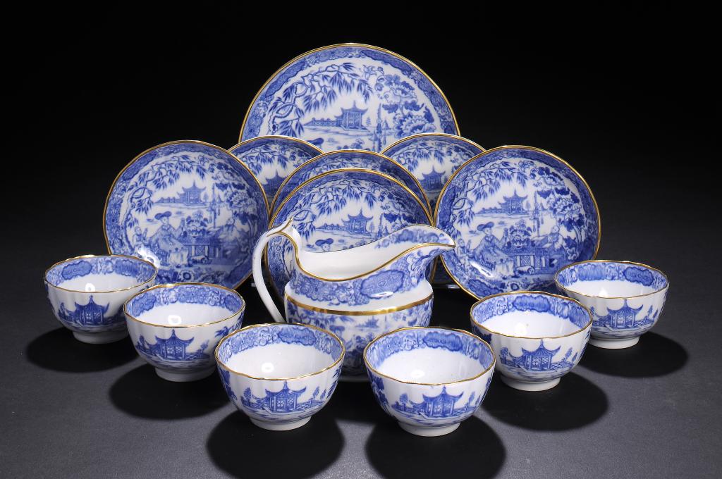 A SET OF SIX STAFFORDSHIRE PORCELAIN FLUTED BLUE AND WHITE TEA BOWLS AND SAUCERS, A SAUCER DISH